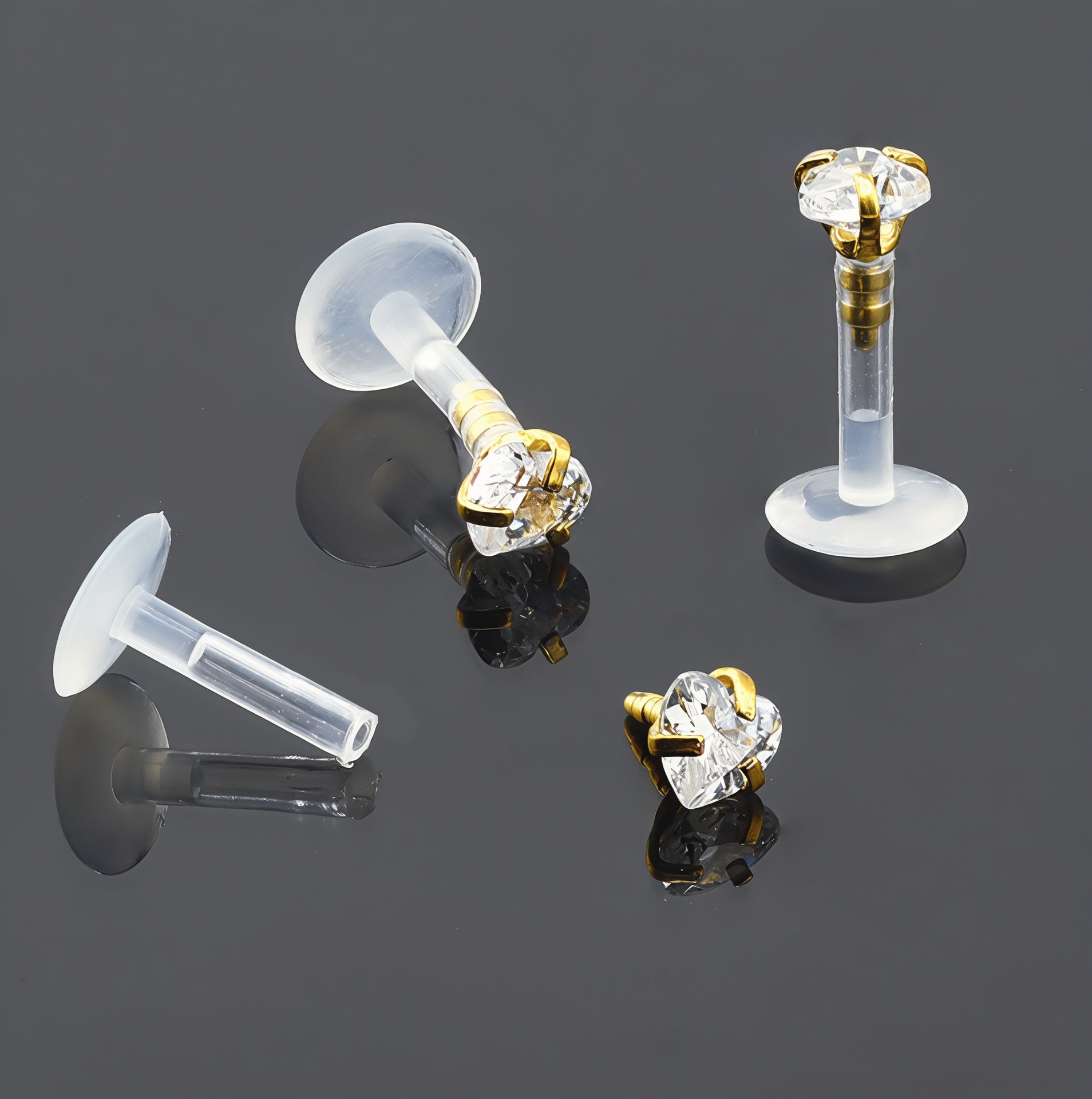 Push-In Bioflex Labret mit Gold Steel Top und 3mm Kristall in Herz Design mit Krabbenfassung - Stärke 1.2mm Länge 6mm - CC Kristallklar