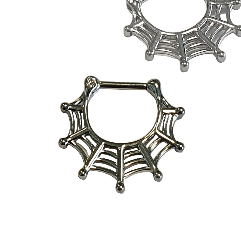 Steel septum clicker in spider web design